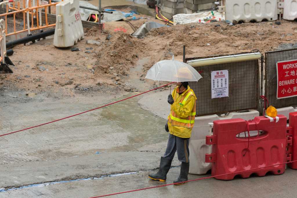 Concrete contractor on a construction site in the rain | EasyMix Concrete