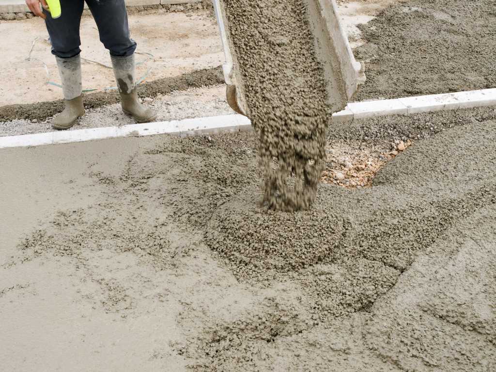 concrete being poured out of a cement truck | EasyMix Concrete
